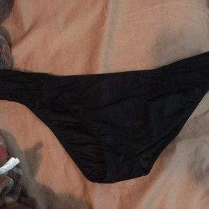 Two pairs of size medium swim bottoms.